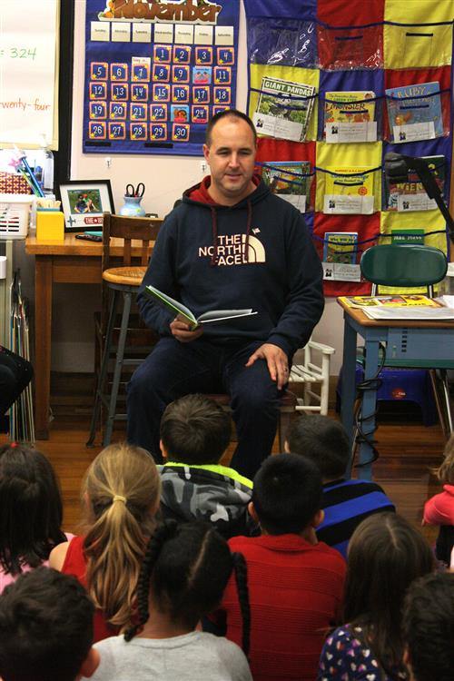Parent reading to class 